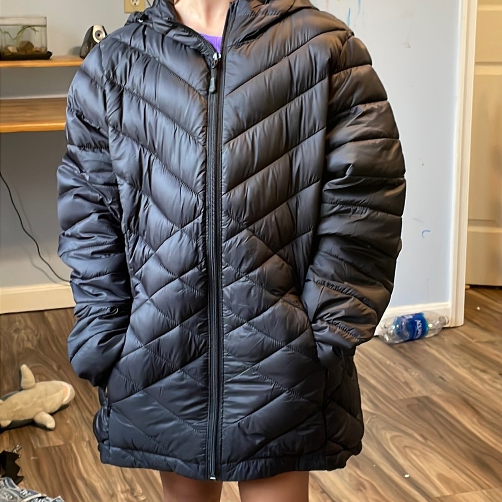 A winter jacket, basic black, made in china, size medium, puffy coat